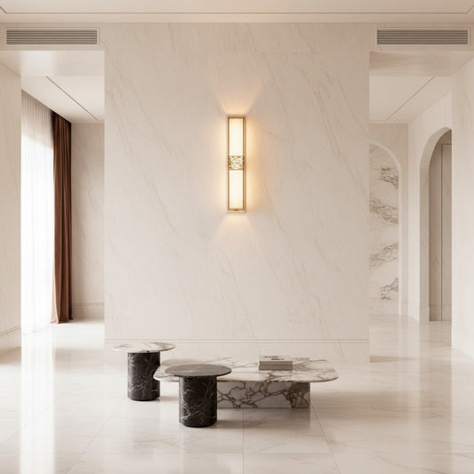 Lorvali linear wall sconce with copper frame and white marble shade emitting warm LED light in a modern hallway