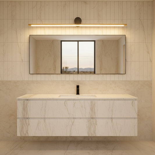 Lorvali modern linear vanity light bar with gold and black finish mounted above a bathroom mirror in a marble room