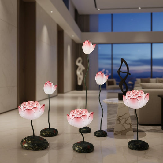 Lorvali lotus flower floor lamps with pink glass shades and resin stone bases arranged in a modern living room