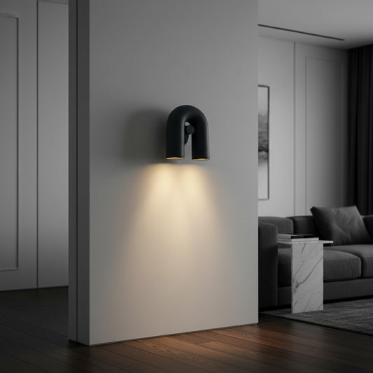 Lorvali matte black U-shaped rotatable LED wall sconce mounted on a white wall in a modern living room