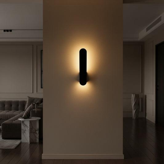 Lorvali minimalist black LED backlit wall lamp casting a warm glow on a modern living room wall