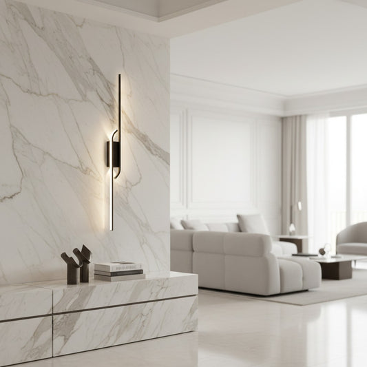 Lorvali minimalist black aluminum LED linear wall light mounted on a white marble wall in a modern living room.
