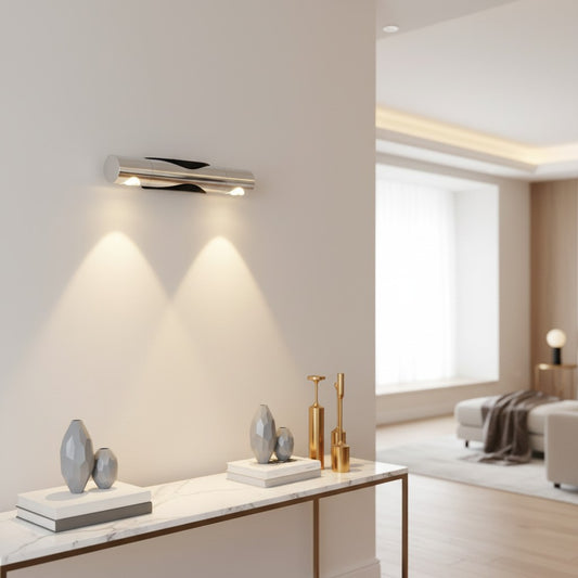 Lorvali modern aluminum wall washer lamp with silver body and black base, emitting warm up and down light in a hallway.