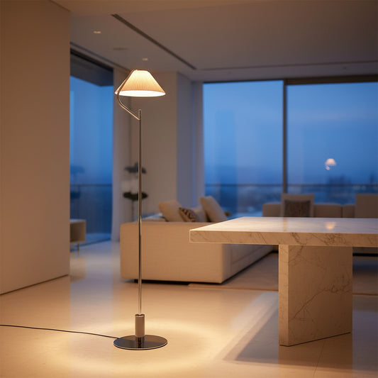 Lorvali modern floor lamp with a sleek chrome metal body and white pleated acrylic shade emitting warm LED light.
