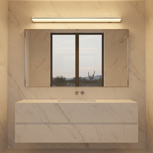 Lorvali modern LED bathroom vanity light with polished iron trim mounted above a mirror in a marble-tiled bathroom.