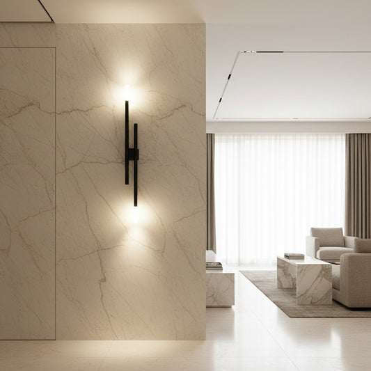 Lorvali modern linear wall sconce in blackened copper mounted on a marble feature wall in a minimalist living room.