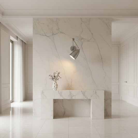 Lorvali modern metal swing arm wall light with adjustable joints mounted on a white marble wall above a console table.
