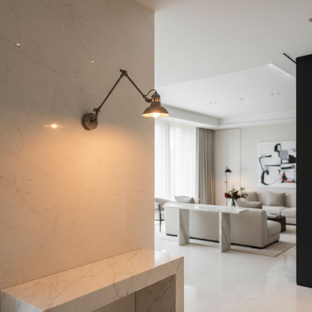 Lorvali nickel swing arm sconce with industrial design mounted on a marble wall in a modern living room