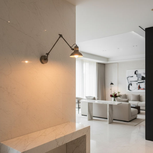Lorvali nickel swing arm sconce with industrial design mounted on a marble wall in a modern living room