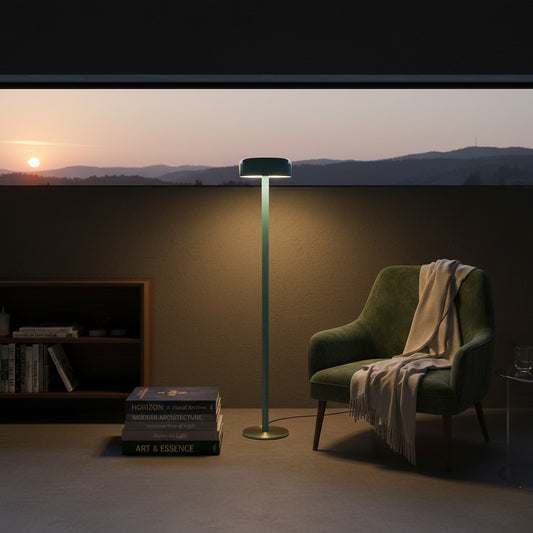 Lorvali Remlo minimalist floor lamp in light blue with a sleek articulated arm, illuminating a cozy reading nook.
