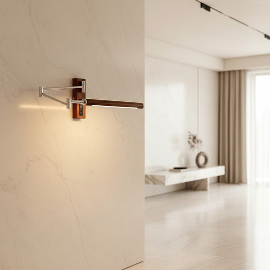 Lorvali mid-century swing wall light with silver iron arm and walnut wood accents mounted on a marble wall