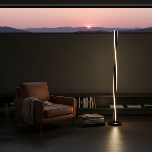Lorvali modern black aluminum twisted stick floor lamp with integrated LED lighting in a cozy living room setting.