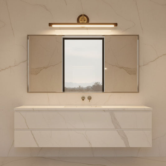 Lorvali bathroom vanity bar light fixture in walnut wood and copper mounted above a mirror in a marble bathroom.