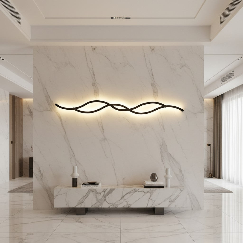 Lorvali modern wavy LED wall light with black aluminum frame and soft silicone shade mounted on a marble wall.